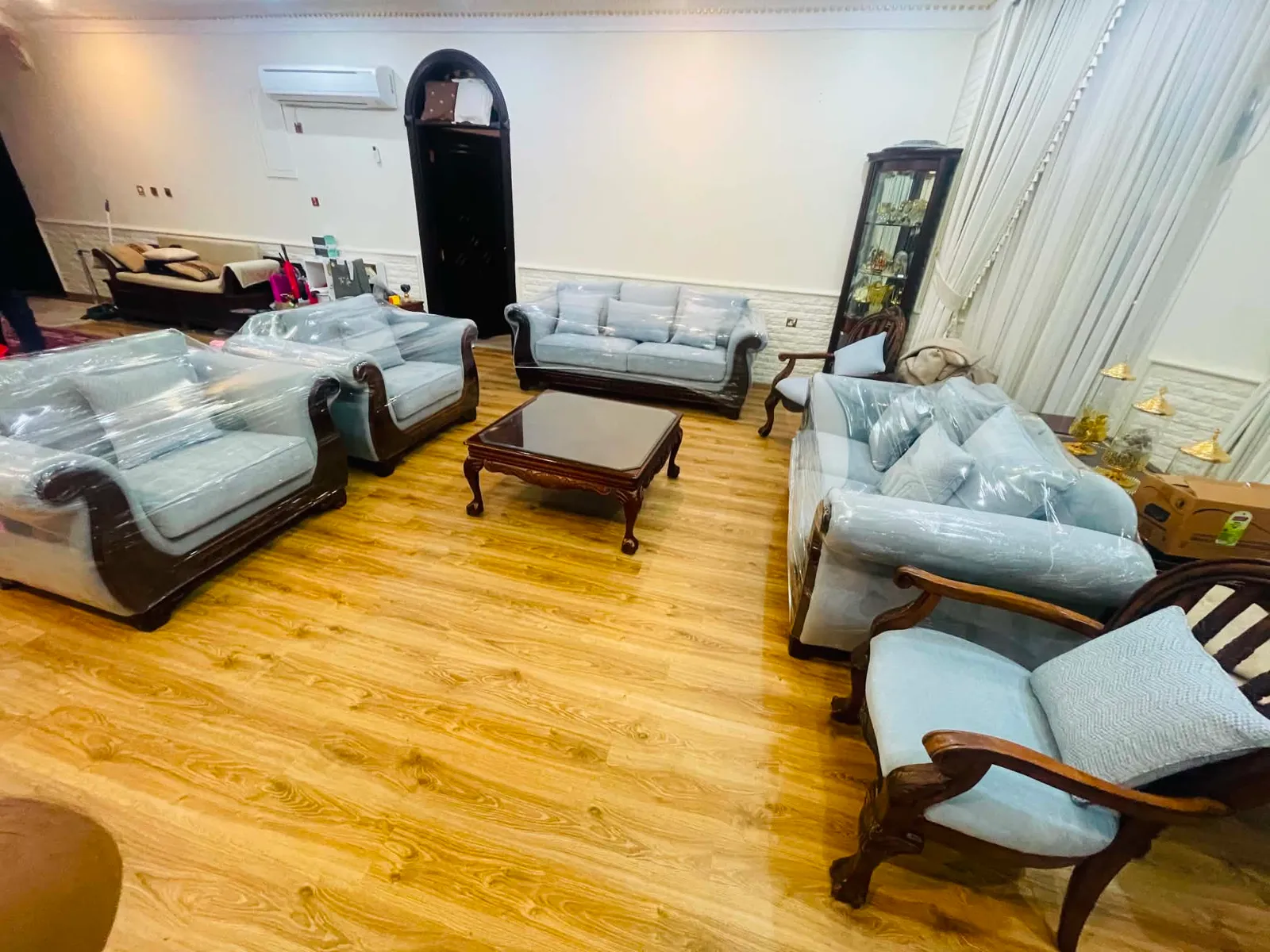 Full majlis of reupholstered pale blue seating in a Qatar villa