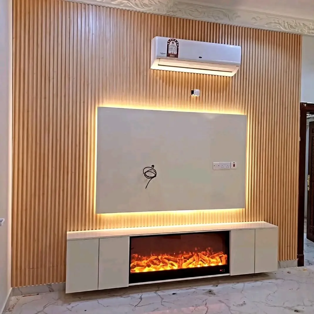 Slat media wall with a floating TV cabinet and inset electric fireplace
